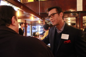 David Ono, ABC anchor and AAJA-LA Vice President of Broadcast, talks to an attendee at the chapter's Far Bar mixer on Jan. 23 